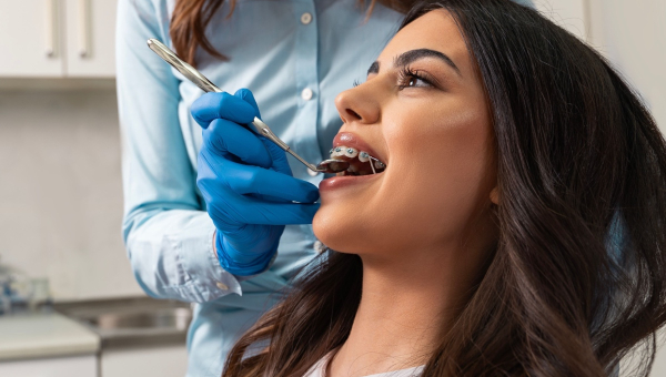 A dental braces patient with her dentist